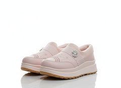 Pair of pink slip-on shoes with decorative elements