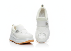 Pair of white sneakers with decorative elements