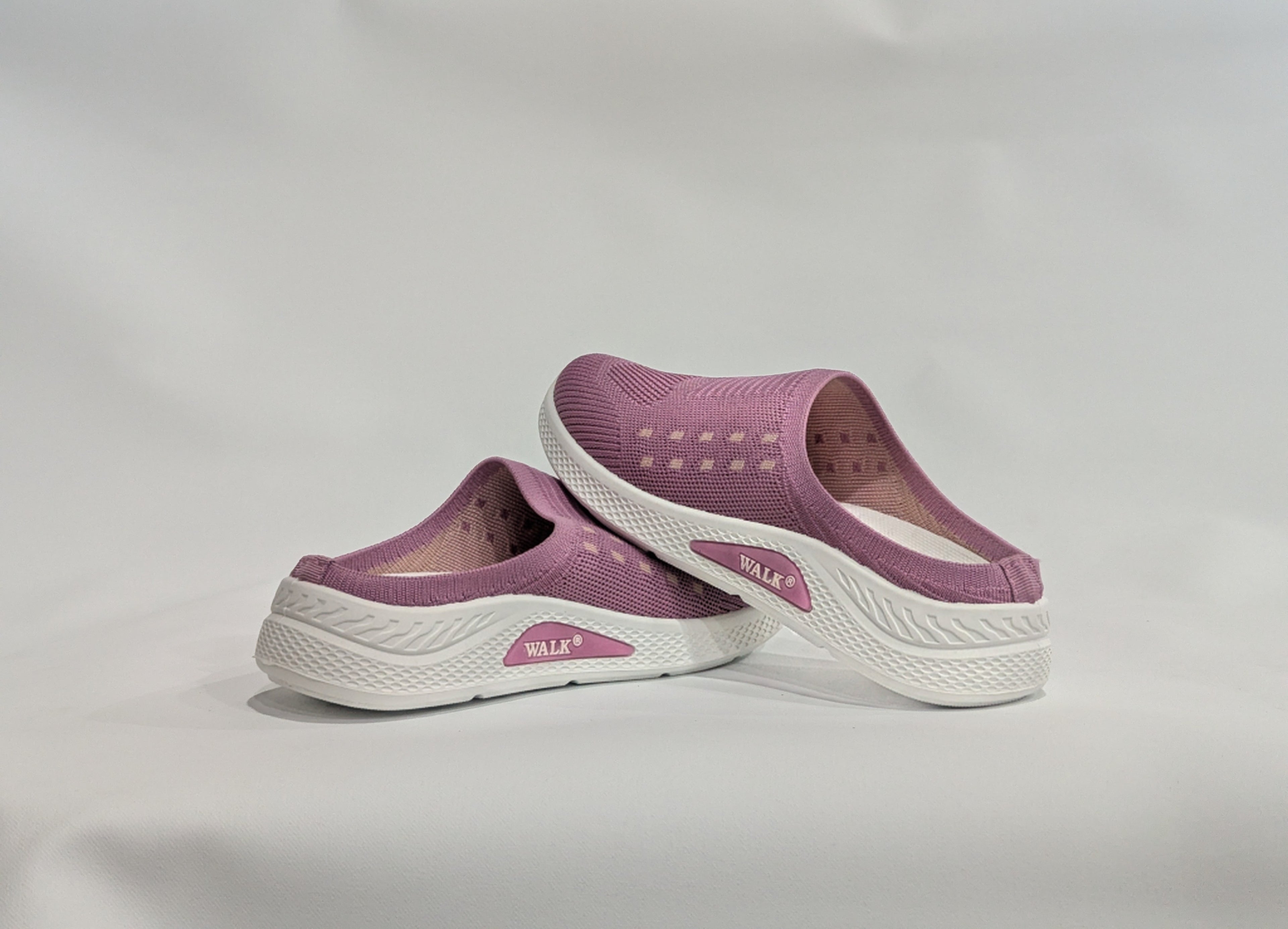 Purple slip-on shoes with white soles