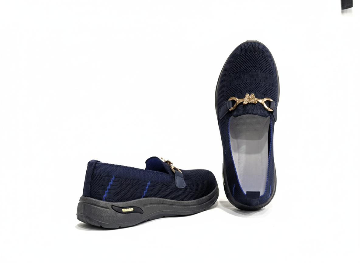 Pair of Blue loafers with gold accents 