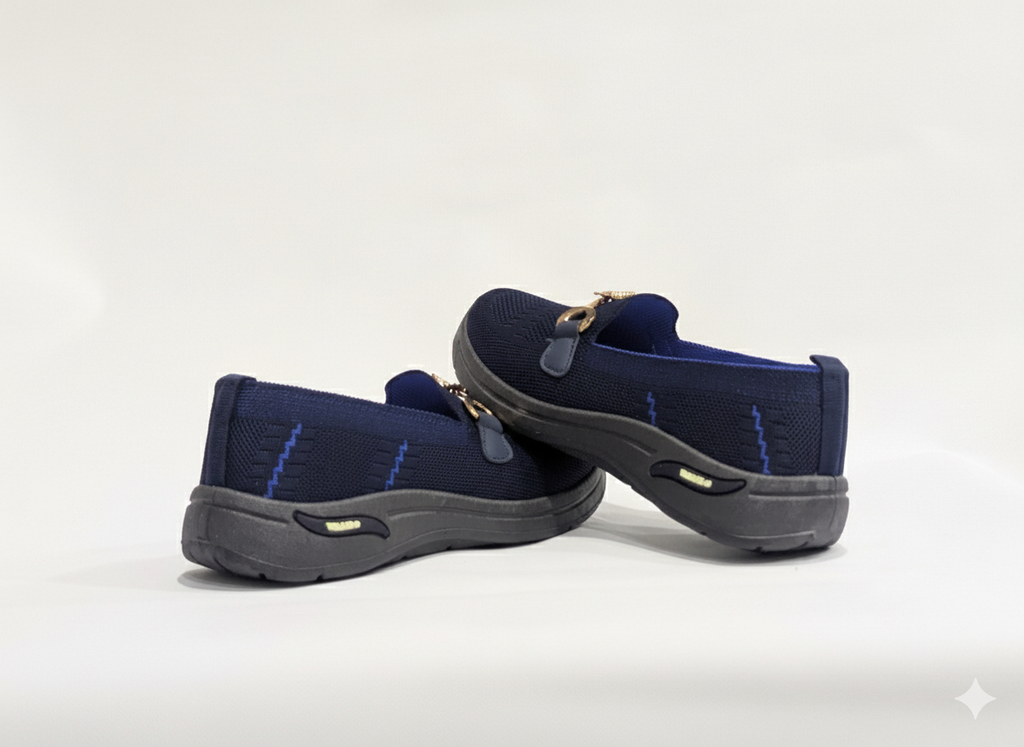Pair of Blue loafers with gold accents 