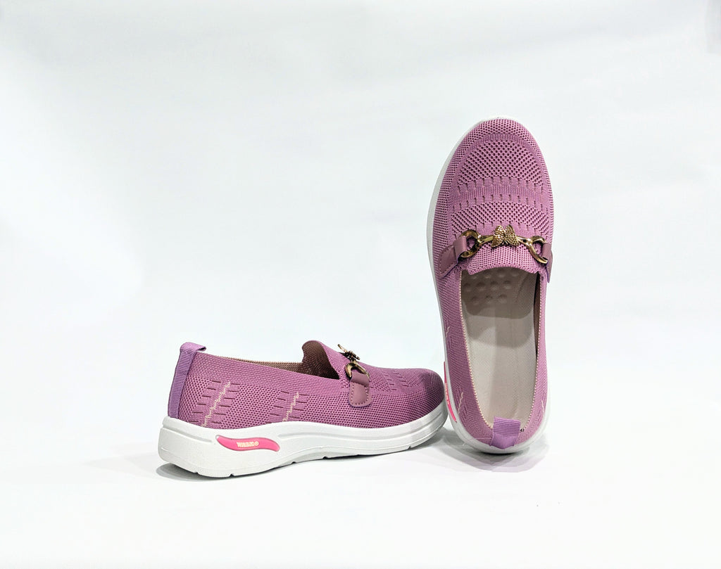 Pair of Pink loafers with gold accents 