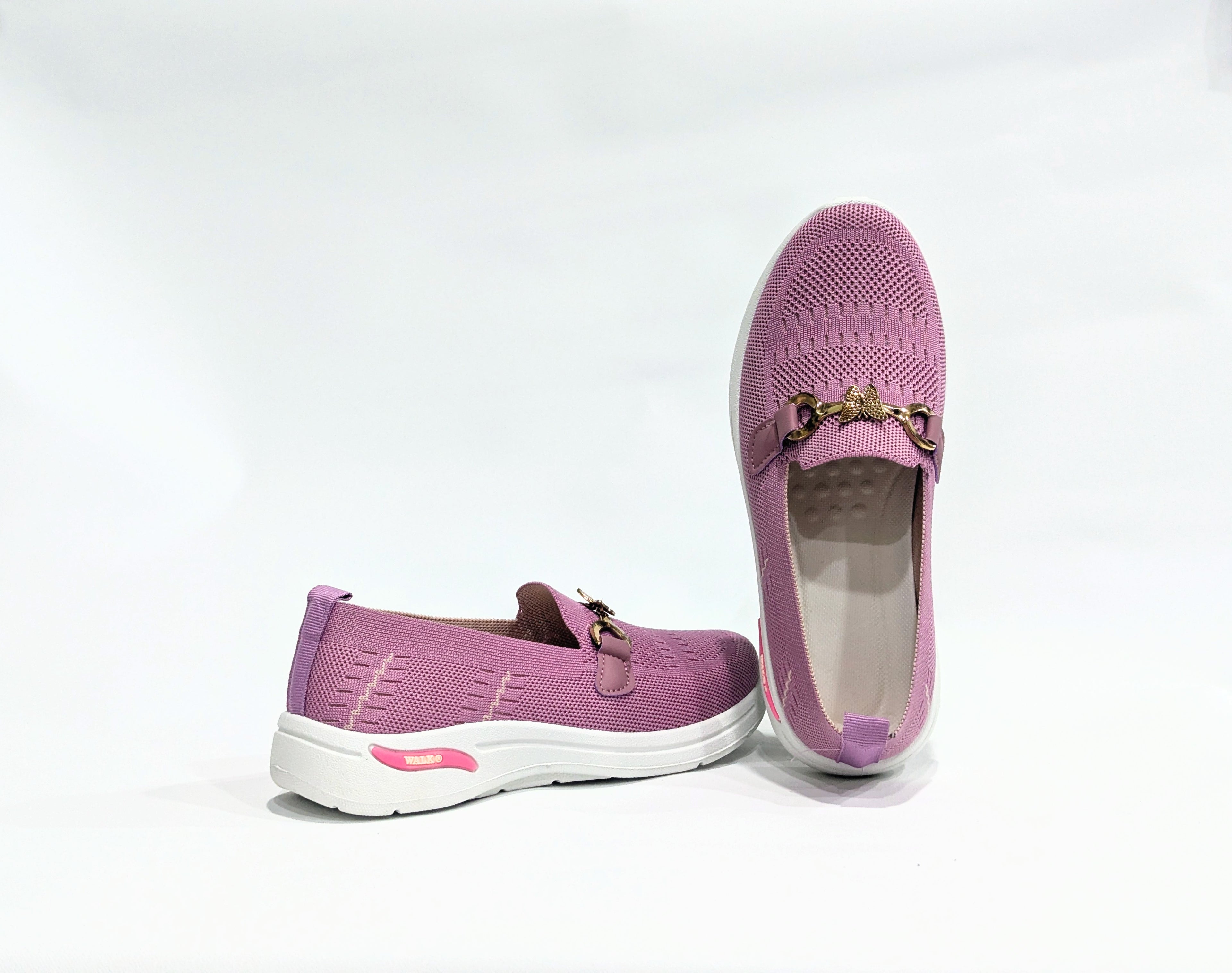 Pair of Pink loafers with gold accents 