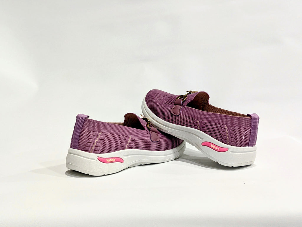 Pink slip-on shoes with white soles 