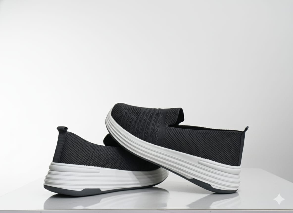 Grey slip-on shoes with white soles 