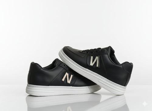 Black sneakers with a text "N"