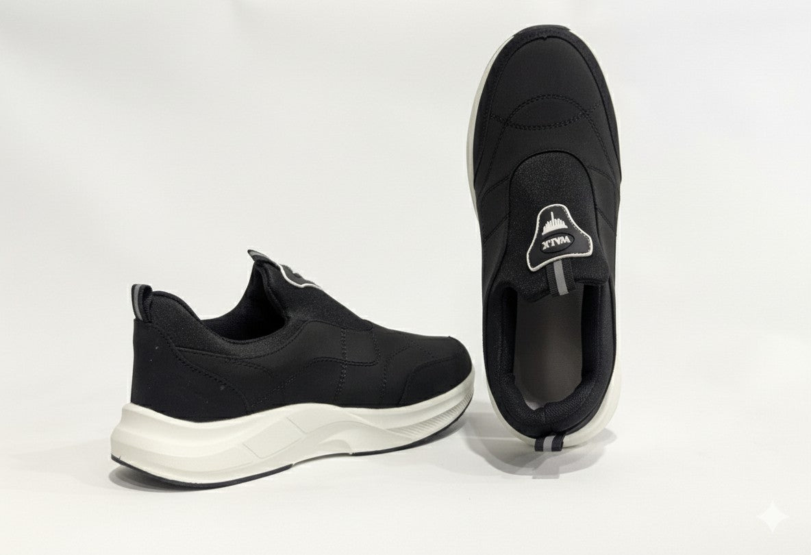 Black slip-on shoes with white soles 