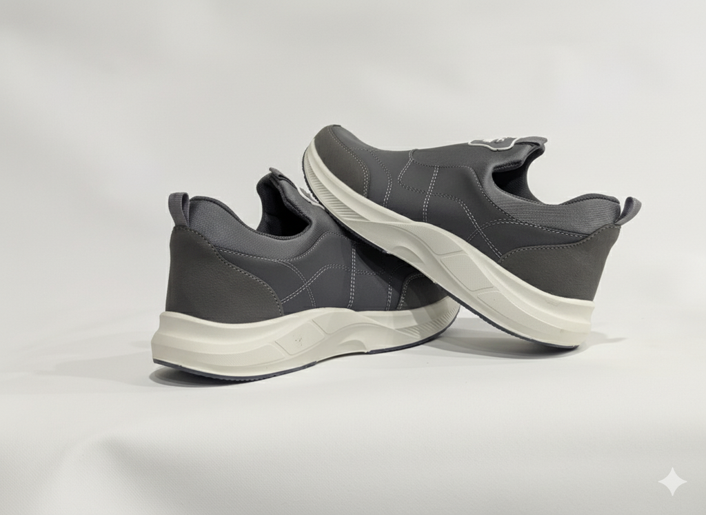 Pair of gray athletic shoes with white soles